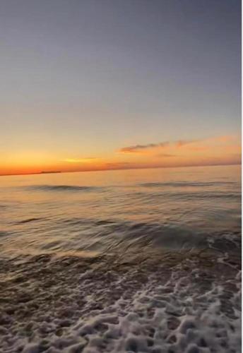 a view of the ocean with the sky and clouds at Sea Harmony in Adelianos Kampos