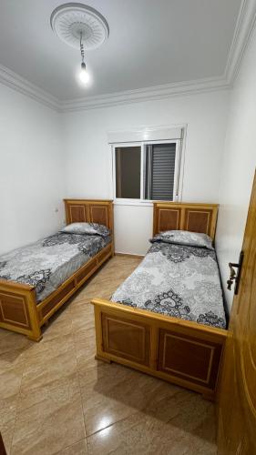 Tempat tidur dalam kamar di Appartamento Vacanze a Martil