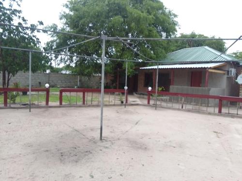 a basketball hoop in front of a building at Maun self catering accommodation in Maun