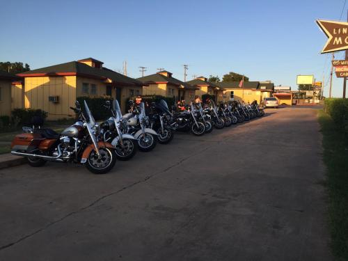 
motorcycles parked in front of a building at Lincoln Motel in Chandler
