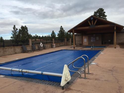 a large swimming pool with a pavilion with at Bryce Canyon Pines Lodge in Bryce Canyon