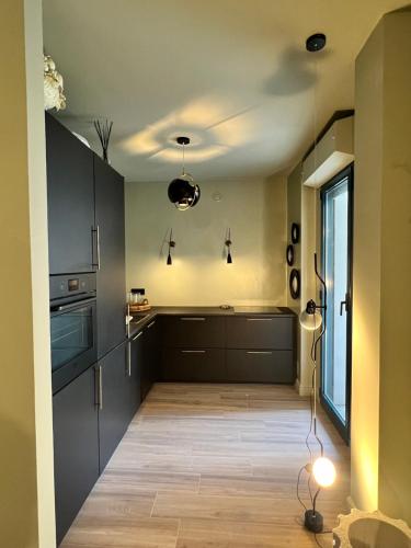 Η κουζίνα ή μικρή κουζίνα στο 5 Viale Fano Apartment