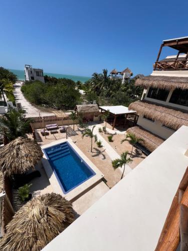 a view of a resort with a swimming pool at Atenea Holbox in Holbox Island