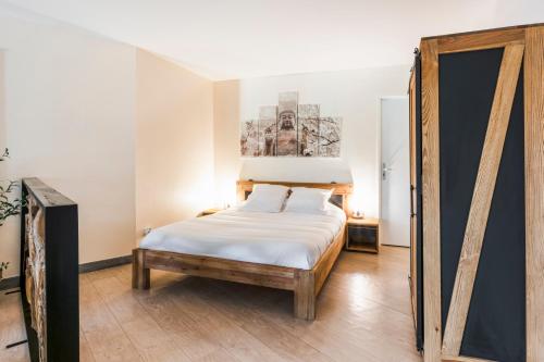 Posteľ alebo postele v izbe v ubytovaní Les balcons de l'Hermitage