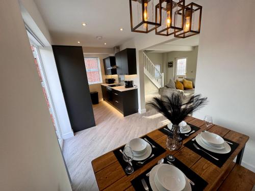 an aerial view of a living room and kitchen with a dining table at The perfect place 3 Bedroom house with garden and parking in Barnsley