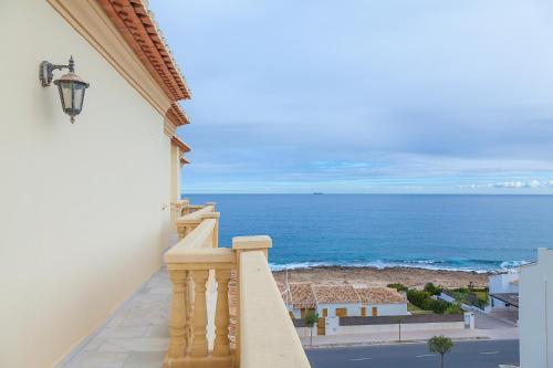 a balcony with a view of the ocean at Mar-Beach front apartment in Jávea in Jávea