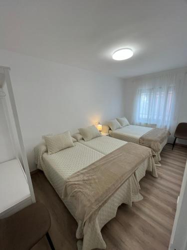 Postel nebo postele na pokoji v ubytování La Alameda