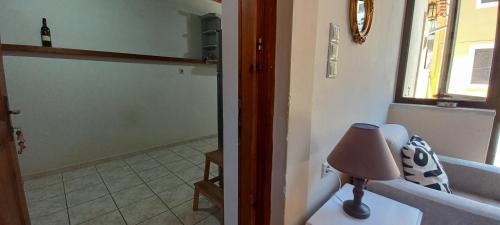 a bathroom with a shower and a lamp in a room at Dafnon Stone House in Leonidion