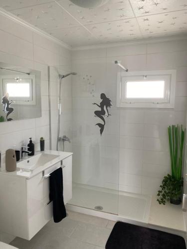 a bathroom with a shower and a sink at Casa Yurena in Playa Honda