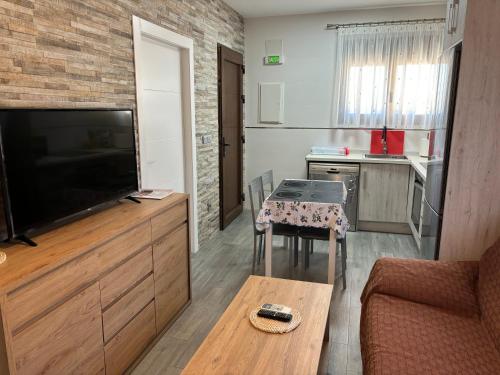 TV a/nebo společenská místnost v ubytování La Escapada