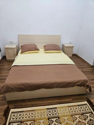 Giường trong phòng chung tại Cabana Cezar