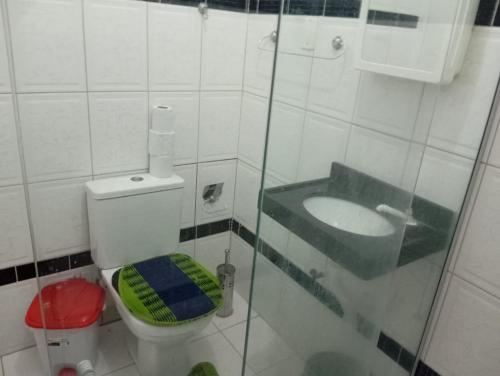 a small bathroom with a toilet and a sink at Perto do Chevrolet Hall in Recife