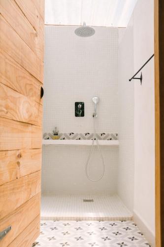a bathroom with a shower with a bath tub at miCielo - Baumhäuser in Vejer de la Frontera
