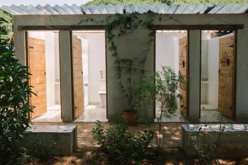 a room with a bathroom with a toilet in it at miCielo - Baumhäuser in Vejer de la Frontera