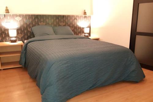 Кровать или кровати в номере Logement neuf et cosy proche centre ville