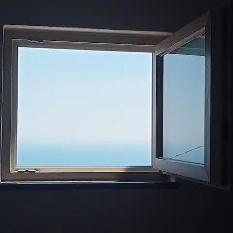 an open window in a dark room with at Domus Julia in Furore