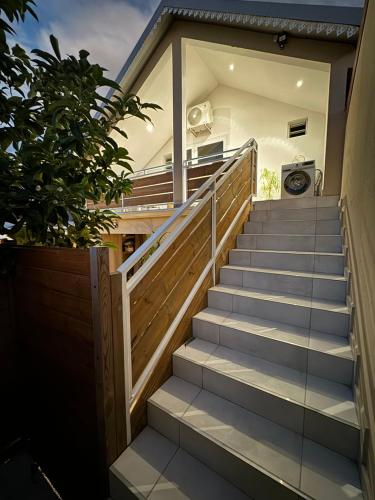 a set of stairs leading up to a house at Grand studio charmant, tout équipé… in Saint-Denis