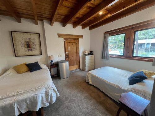Postel nebo postele na pokoji v ubytování Suite Fontana Baja