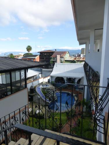a view from the balcony of a building with a swimming pool at Hotel Santo Tomas / Historical Property in San José