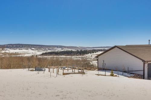 a house in the snow next to a building at 24STR-00027 Fairplay Cabin with Mountain Views! in Fairplay