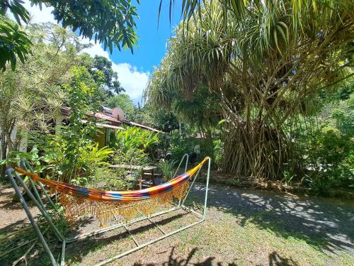 a hammock in a garden in a yard at Résidence Les Manguiers in Pointe-Noire
