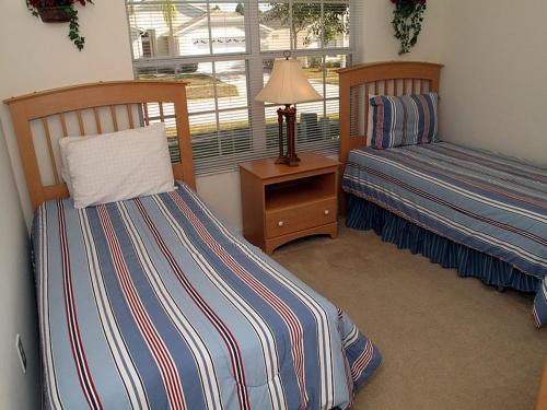 Krevet ili kreveti u jedinici u okviru objekta Wyndham Palm Villa 2216