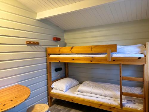 a bunk bed room with two bunk beds in a cabin at Winjum Cabin Aurland Stegastein in Aurland