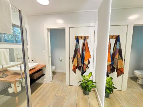 a bathroom with a toilet and a sink at Viewpoint in Onetangi