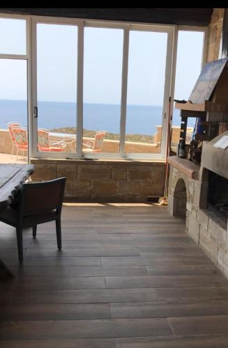 a living room with a view of the ocean at Elafonisi Villa above the Beach in Elafonisi