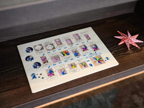 a card on a table next to a starfish at Iga Ueno City Hotel in Iga