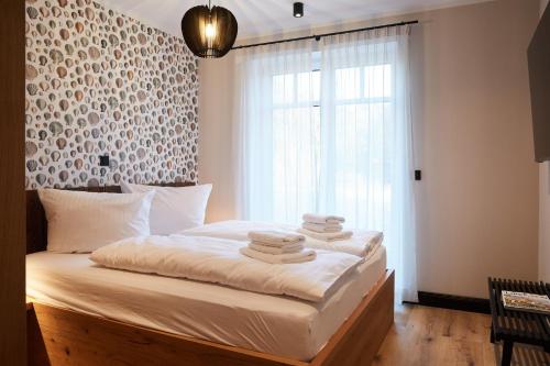 En eller flere senge i et værelse på Binnendiek Haus 1 Apartment 4