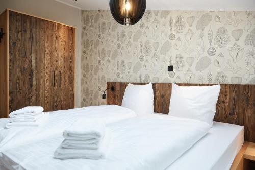 En eller flere senge i et værelse på Binnendiek Haus 1 Deluxe-Apartment 9