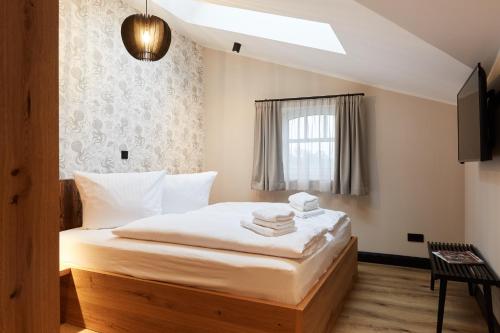 En eller flere senge i et værelse på Binnendiek Haus 1 Comfort-Apartment 10