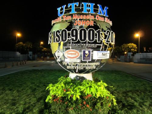 a sign for a museum in a field at night at RG Grand Hotel in Parit Raja