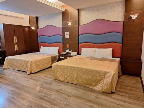 Ένα ή περισσότερα κρεβάτια σε δωμάτιο στο Xinghe Motel - Chaozhou