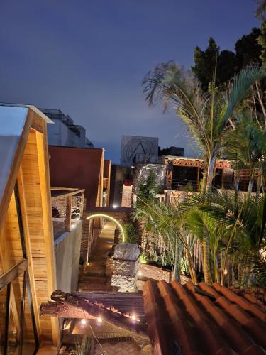 a stairway leading to a building with palm trees at Tinny Houses in El Gallinero
