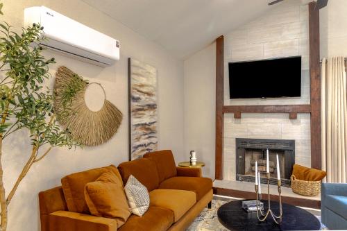 a living room with a couch and a fireplace at Prime Location - 3bd with BBQ in McKinney