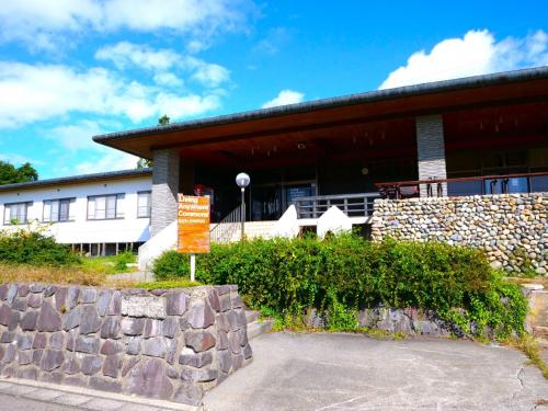 a building with a sign in front of it at LivingAnywhere Commons Aizu Bandai Japanese style room- Vacation STAY 74361v in Bandai