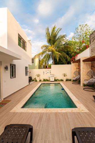 a swimming pool in the yard of a house at Villa Lugo Lahoz in San Felipe de Puerto Plata