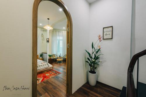 a mirror in a room with a living room at MiaCasaHanoi - King Bed - Free laundry - Netflix & Rooftop Chill in Hanoi