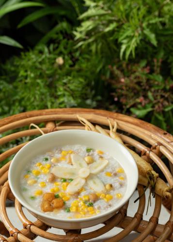 a bowl of soup in a wicker basket at Saha Casa Boutique Hotel Da Nang in Da Nang