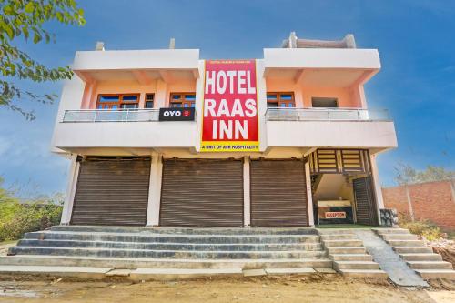 a hotel with a hotelras inn sign in front of a building at Flagship Hotel RAAS INN in Kānpur