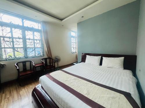Postel nebo postele na pokoji v ubytování Khách Sạn Avatar