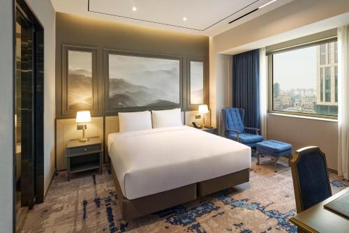a hotel room with a bed and a window at Grand Mercure Imperial Palace Seoul Gangnam in Seoul