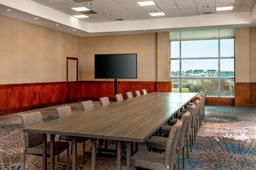 a conference room with a large table and chairs at The Westin Boston Seaport District in Boston