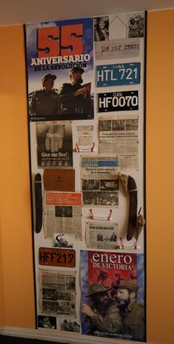 a poster hanging on a wall in a room at Domek Podróżniczy in Łódź