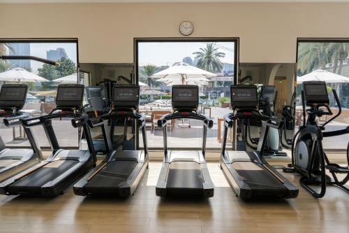 a gym with a bunch of exercise bikes at Le Meridien Abu Dhabi Resort in Abu Dhabi