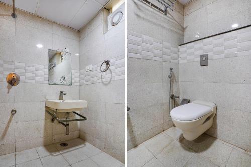 a bathroom with a toilet and a sink at FabExpress Ginger Suites - Nr BHEL LTD in Bengaluru