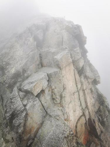 an image of a rocky mountain in the fog at Modern Studio Perauer in Gmünd in Kärnten