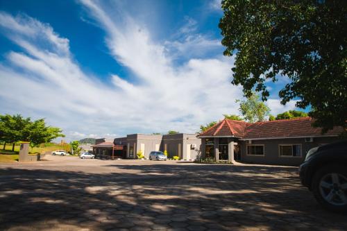 a parking lot in front of a building at Fatmols City Hotel in Ndola